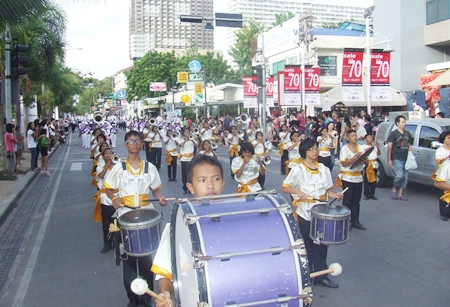 Marching bands march down Beach Road trying to be the best of the Thailand International Marching Band Competition.